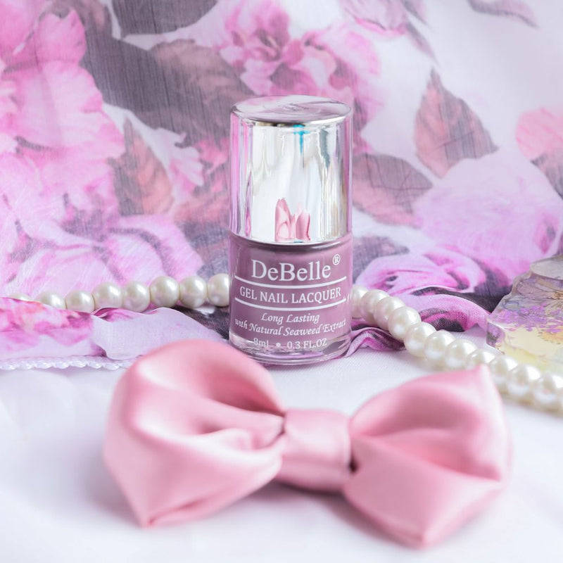 DeBelle Mauve orchid nail polish bottle in classy setup 